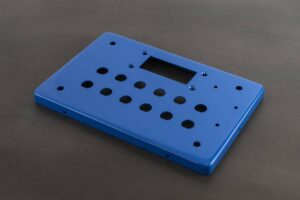 Cover Panel With Countersunk Holes for Screen Mounting and D Holes for Mounting of Switches, Buttons, and Connectors